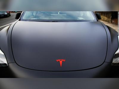 Tesla's market value tops $500 billion for the first time