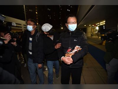 Lawyer Daniel Wong Kwok-tung meets supporters outside Sha Tin Police Station after his release last night.