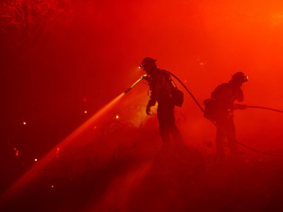 Photos: Fire crews battle massive blazes across US West