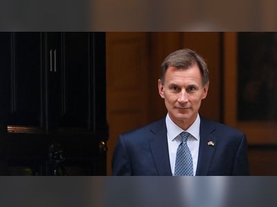UK's Hunt, criticised by some Conservatives, defends tax hikes